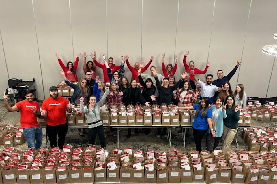 Volunteers show the fruit of their labour, stuffing the bags handed out for the 22nd annual United Way BC North Okanagan Drive-Thru Breakfast, held Wednesday, Oct. 2, at the Prestige Vernon Lodge. 