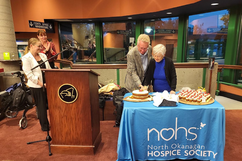 Current board president Bruce Shepherd and original board member Barb Schimpl cut the cake in celebration of the North Okanagan Hospice Society's 40th anniversary. Looking on during the event held at the Vernon and District Performing ARts Centre Tuesday, Oct. 15, are incoming and outgoing hospice executive directors Megan Cox (left) and Lisa Matthews.