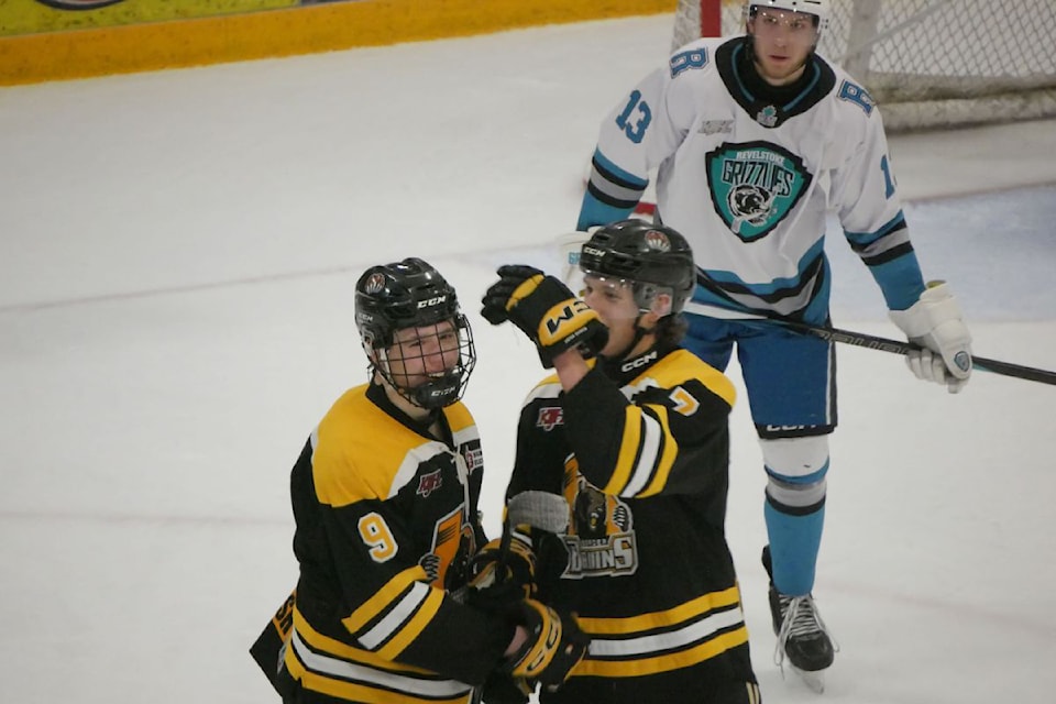 Vernon's Tyler Burke (left) receives congratulations from teammate Russell Kosec after scoring one of his two goals in a 5-1 romp over the hometown Revelstoke Grizzlies during Game 3 of the KIJHL's Teck Cup final Saturday, April 12, in Revelstoke.