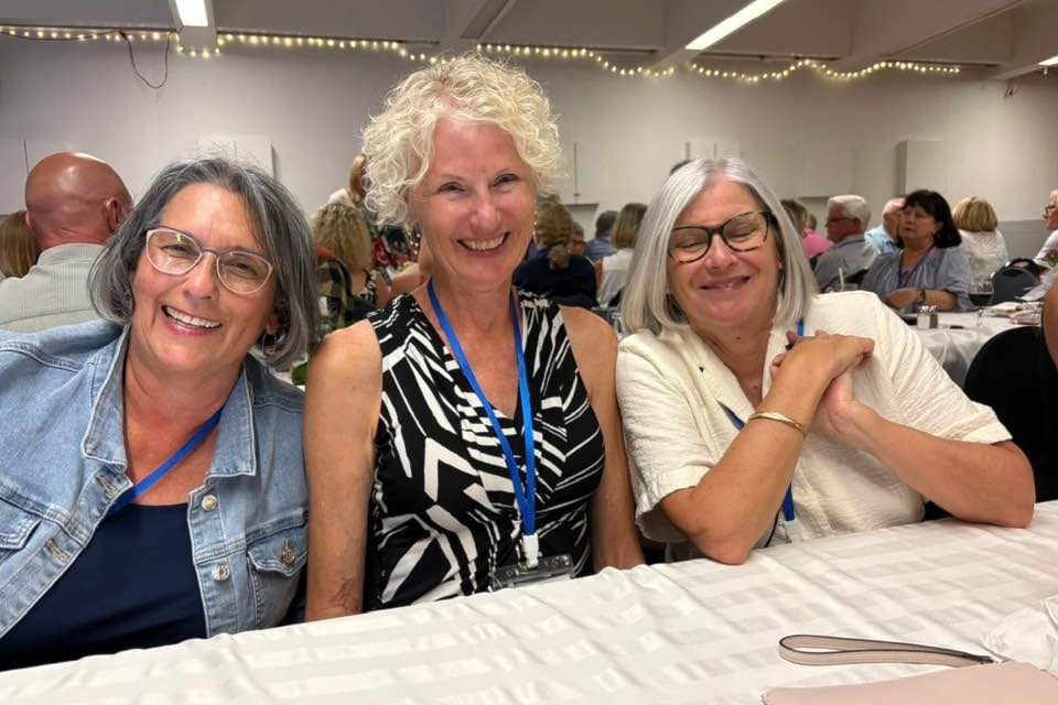 Class of 1975 grads (from left) Laurie White, Glenda Baird and valedictorian Barb Bunting smile for the camera.