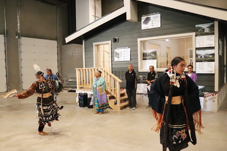 Traditional dancers opened a grand opening event by Splatsin Homes, billed as a bold new step in Indigenous housing, in Vernon Friday, Aug. 8, 2025. 