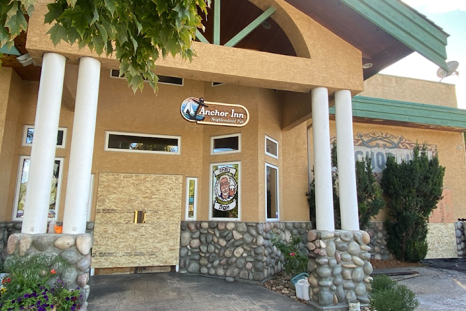 The doors are boarded up at the Anchor Inn Pub in Armstrong after a fire tore through its kitchen area early Tuesday morning, Aug. 19, 2025. 