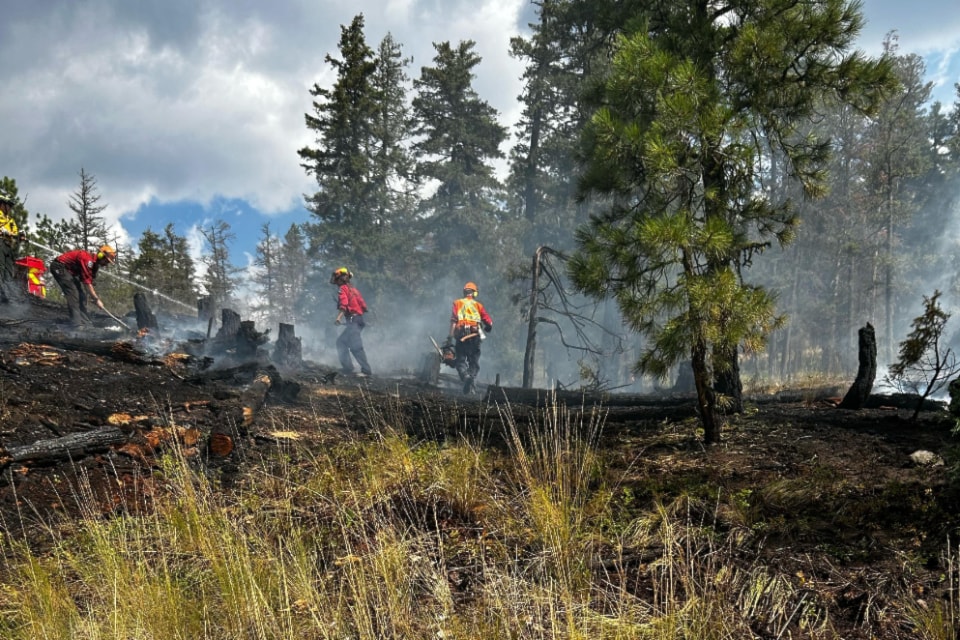The Powers Creek wildfire above West Kelowna was being held as of 11:26 a.m. on Aug. 13, 2025. Police said Aug. 14 it has been contained along with another fire that is believed to be connected.