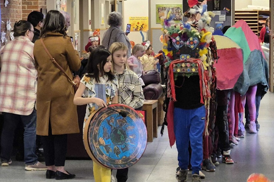 Grade 4-5 students bring a dragon to life at the annual École Beairsto Lunar New Year Parade, held through the hallways of the 116-year-old elementary school Wednesday, Jan. 29.