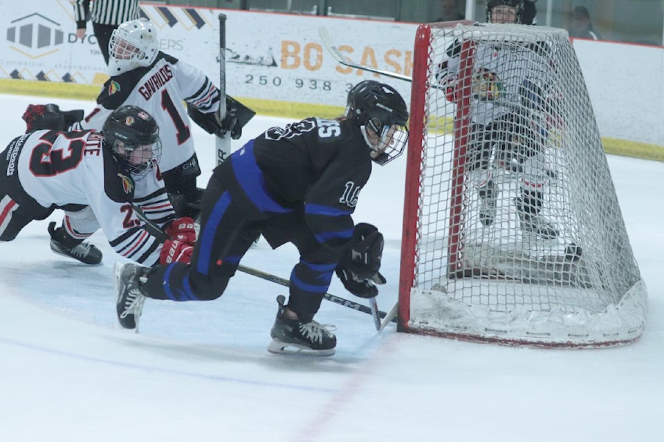 Vernon Watkin Motors Mustangs forward Jett Menzies (dark jersey) scores a tap-in goal during the host team's 10-2 romp over Alberta's Wheatfield Braves in the opening game of the 52nd annual Vernon Winter Carnival Coca Cola Classic Pee Wee Hockey Tournament Thursday, Feb. 13, at Kal Tire Place North.
