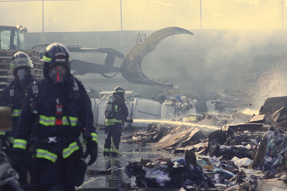 Fire crews snuff out a fire at Emterra Environment recycling depot on Waddington Drive Thursday morning, Feb. 13, 2025.