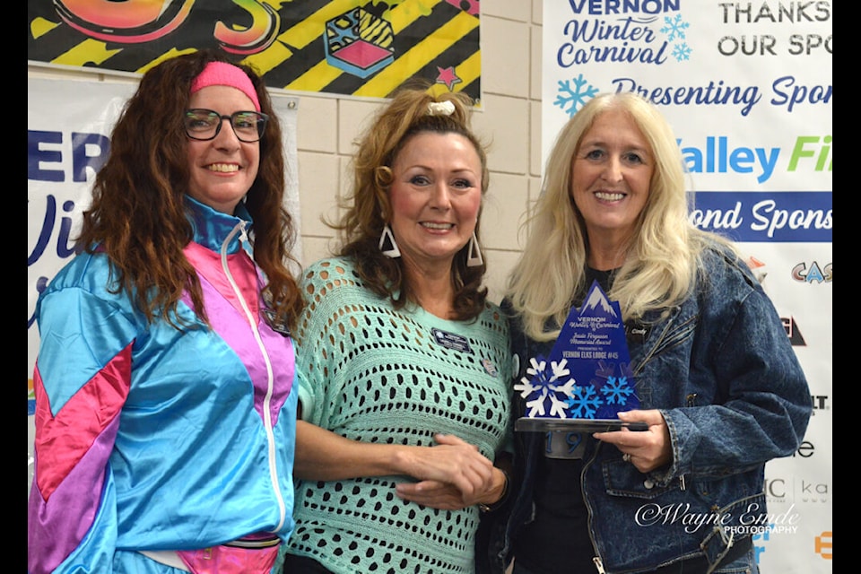 Cindy Palazzo (right) with the Vernon Elks Lodge, accepts the Jessie Ferguson Memorial Award from Carnival's Lisa Fenyedi and Laurell Cornell.