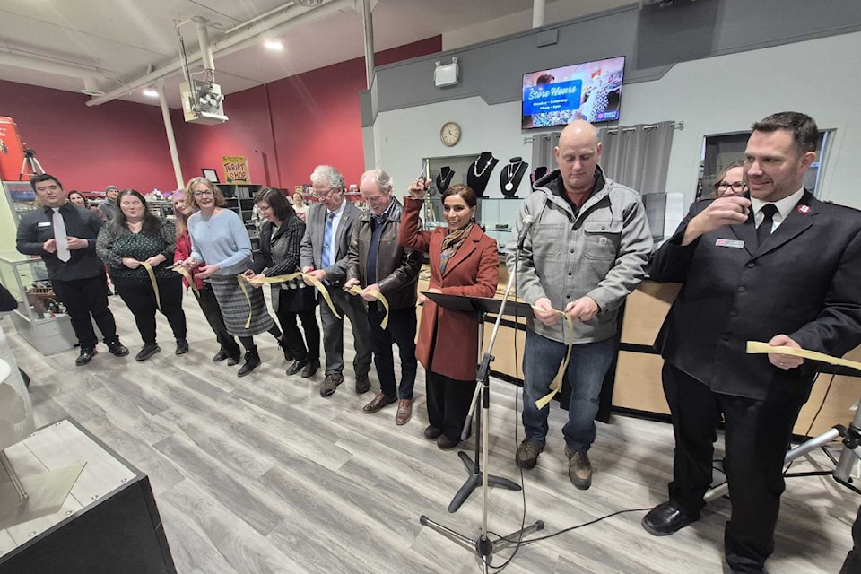 Vernon Salvation Army Community Church Corps Officer Lt. Neil Thompson (right) is joined by a handful of other dignitaries for the ribbon cutting Friday, Jan. 10, to officially open the new Sally Ann Thrift Store in Vernon's Midtown Mall on 43rd Avenue.