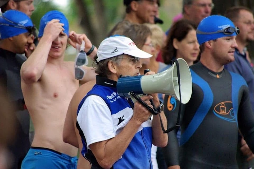 William (Kit) Johaneson (with megaphone) could often be found volunteering at local running and triathlon events. A co-founder of the Kal RATS Club, Johaneson died suddenly at home Jan. 20 at age 80.
