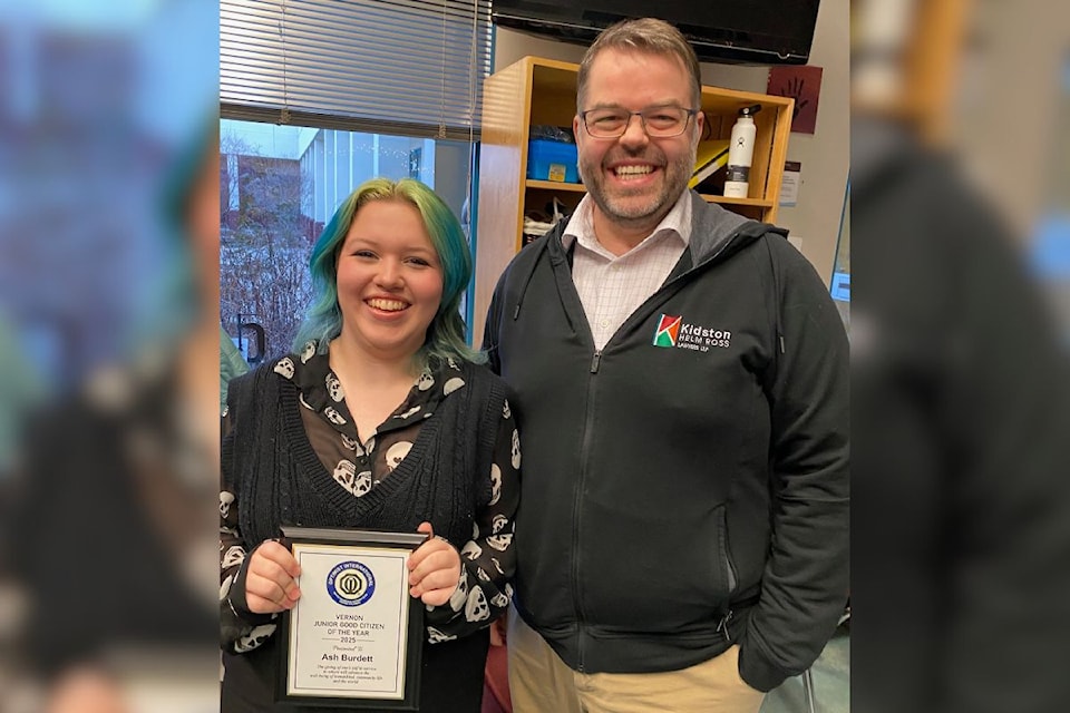 Ash Burdett is presented with her Junior Good Citizen of the Year award from Dustin Griffin of Kidston Helm Ross, event sponsor. 