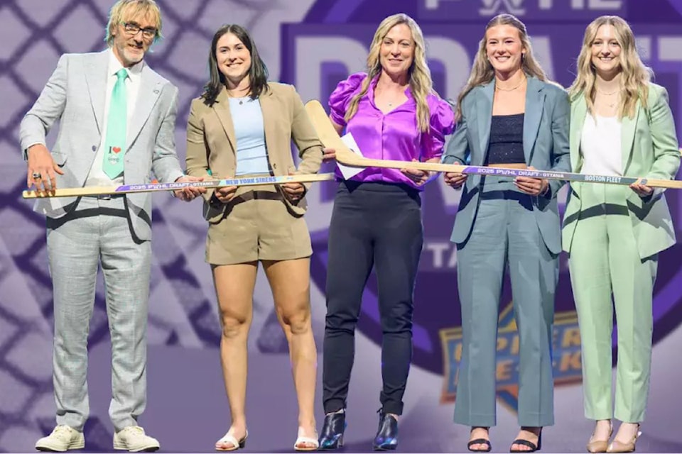 Vernon's Anne Cherkowski (second from left) is greeted by New York Sirens general manager Pascal Daoust (left) after being selected in the second round of the Professional Women's Hockey League 2025 Draft by the Sirens Wednesday, June 24, in Ottawa.