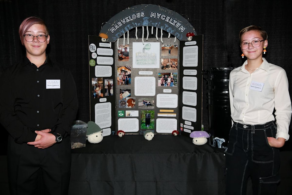 For the second year in a row, AIAO (Awaken) students explored the innovative potential of mycelium (the root-like structure of fungi), for waste management, resource optimization, and sustainable systems. Presenting the display at the CARE Community Impact Awards are Marley Kammerer (left) and Harlow Kammerer. Missing is Chloe Butler.
