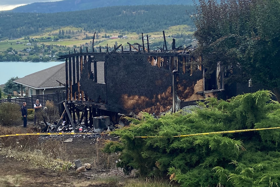 Fire and RCMP officials investigate a fatal house fire in Coldstream.