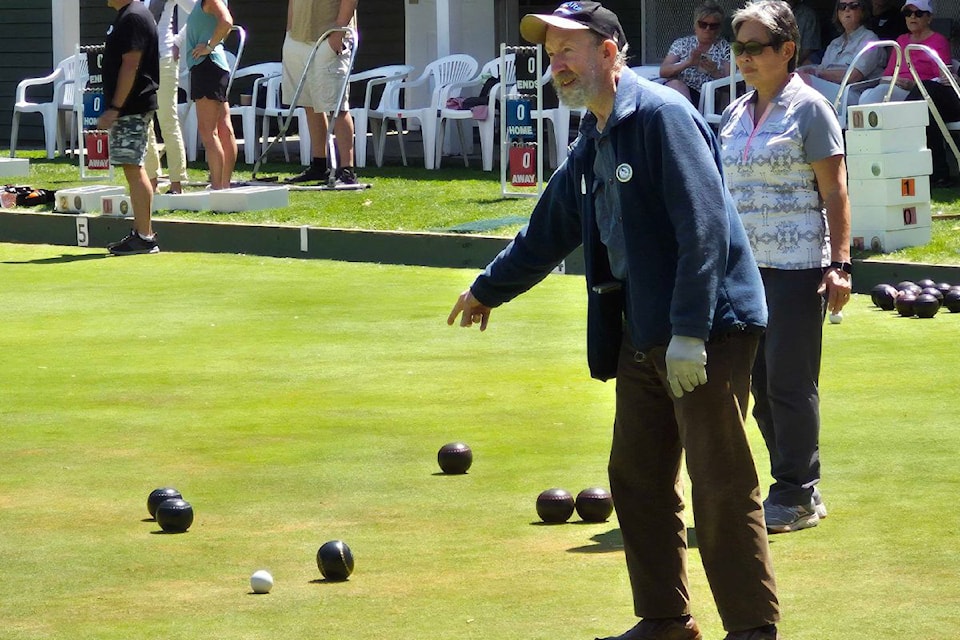 Gerald Humphrey tells his teammate to get their bowl close to the white ball, or jack, as Vernon Lawn Bowling Club member Janny Jung looks on Monday, June 2. An introduction to the sport at the 107-year-0ld club kicked off the third annual Vernon Seniors Week festivities.