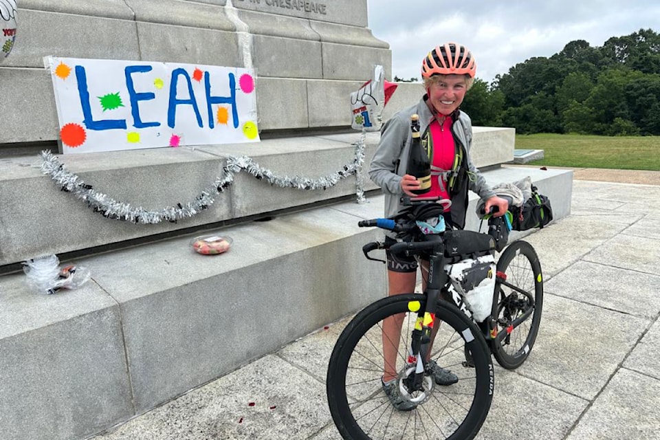 Leah Goldstein celebrates her victory at the 2025 Trans Am Nonstop Bike Race with a bottle of champaign Monday, June 16, 2025. 
