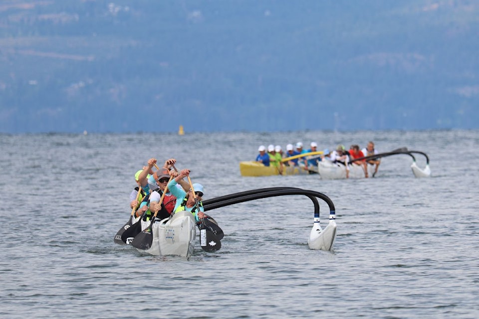 The Kelowna Muscles and Men canoe boat (foreground) won the Freshwater Challenge Outrigger Canoe Race, hosted by the Vernon Paddling Club on Sunday, June 22. 