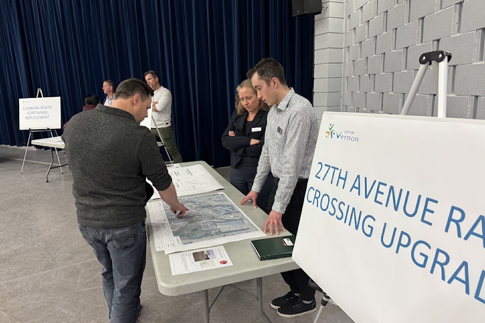 A resident gets the scoop on a 27th Avenue rail crossing upgrade at the City of Vernon's capital works open house Thursday, March 6, 2025. 