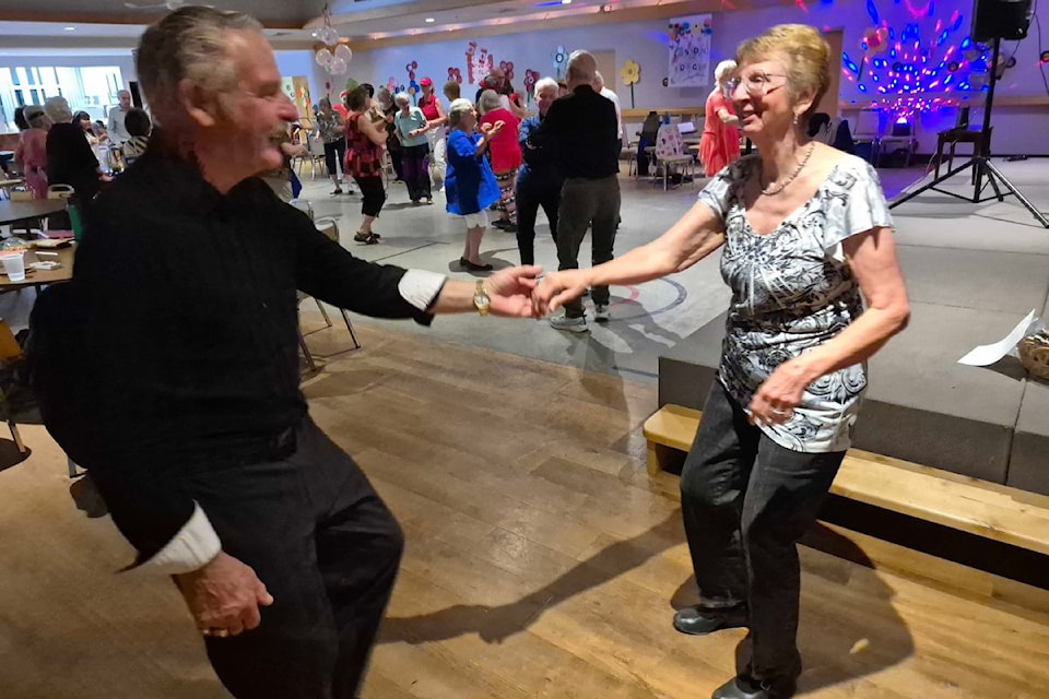 Victoria's Ian Farrell (left) and Peg Bellamy of Desert Cove Estates near Vernon cut a rug during the Fit For Life Dance-a-thon fundraiser Saturday, May 10, at Vernon's Schubert Centre. The event raised nearly $18,000 for the centre.