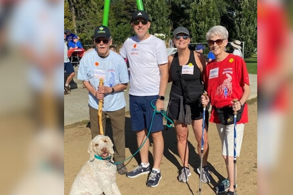 Al Hiebert (from left), son-in-law Rick Mussenden, daughter Sara Hiebert, and wife Peggy Hiebert, along with family dog Alton (front) have been longtime supp;orters of the Parkinson SuperWalk. Al was diagnosed with Parkinson's Disease in 2003.