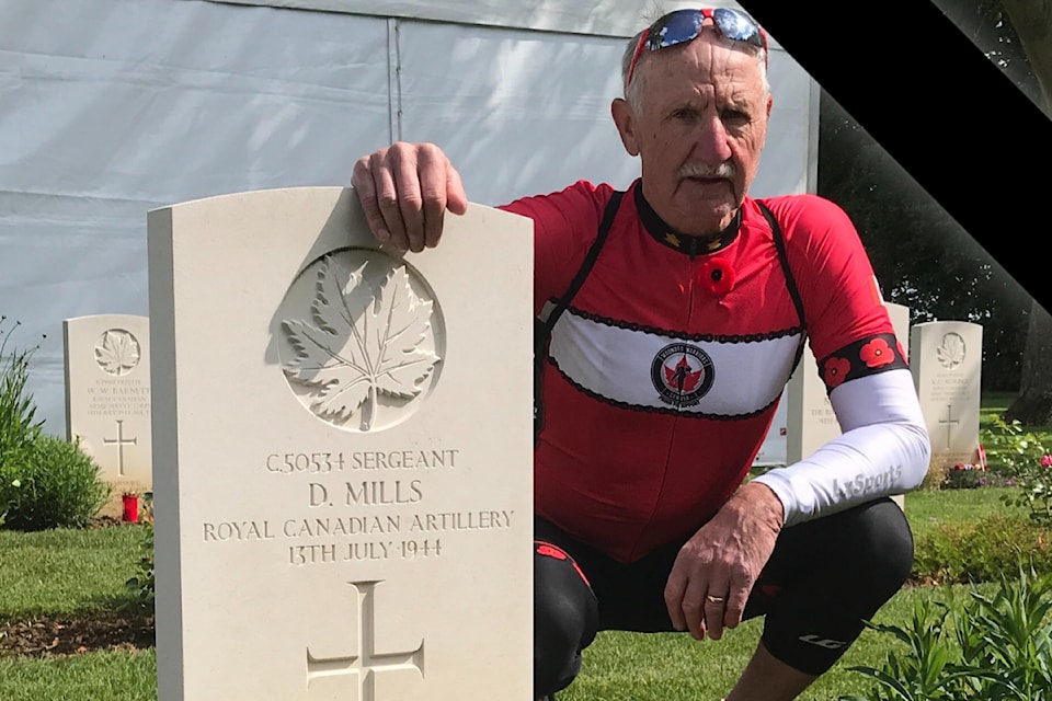 Bob Harding, at his uncle David Mills' headstone in Normandy, France.