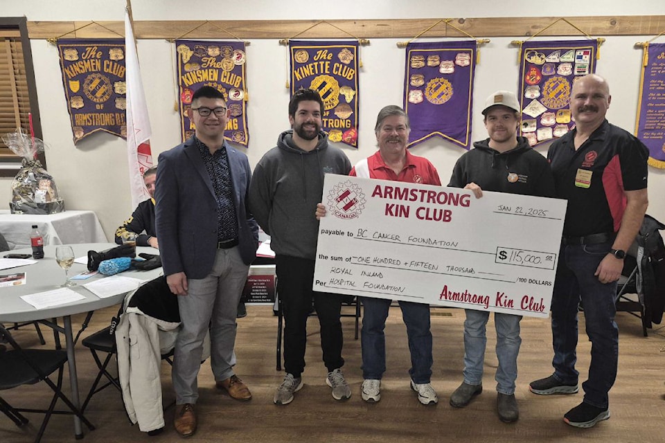 Members of the late Glenna Hoggarth's family, including son Todd (second from left), husband Kevin (centre), and son Brayden (seocnd from right) join Armstrong Kin Club past president Jim Martin (right) in presenting Chris Mayeda of the B.C. Cancer Foundation with a cheque for $115,000. The money was raised in 2024 through a Kin Club Classic Car Raffle in memory of Glenna, who died in 2019 of cancer at age 58.