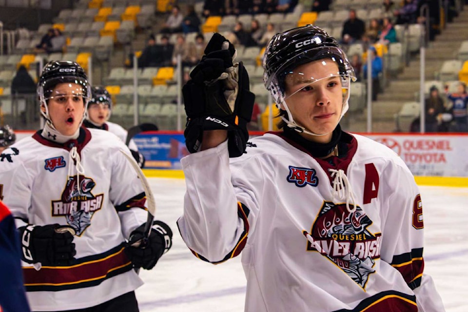 Armstrong's Cash Anderson, front, celebrating a goal for the Quesnel River Rush of the KIJHL, will continue his hockey career at the collegiate level in New York state.
