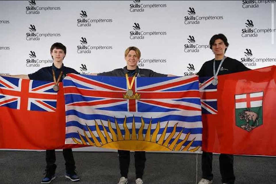 Sy Korf from Enderby's A.L. Fortune Secondary School (centre) won the gold medal in autobody repair at the Skills Compétences Canada competition in Regina. Korf beat out competitors from Ontario (left, bronze) and Manitoba (silver).