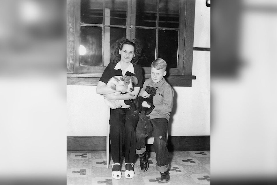 Mrs. June Studybaker and son Danny  are shown with the family dog and family cat at Killiney in 1945. Today, Feb. 20, is Love Your Pets Day. (Museum and Archives of Vernon Photo Nol 20886)