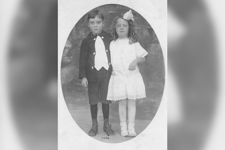 George and Micky McNeill hug one another for the camera in an undated Museum and Archives of Vernon photo. It's National Siblngs Day, Thursday, April 10. (Museum and Archives of Vernon Photo #2229)