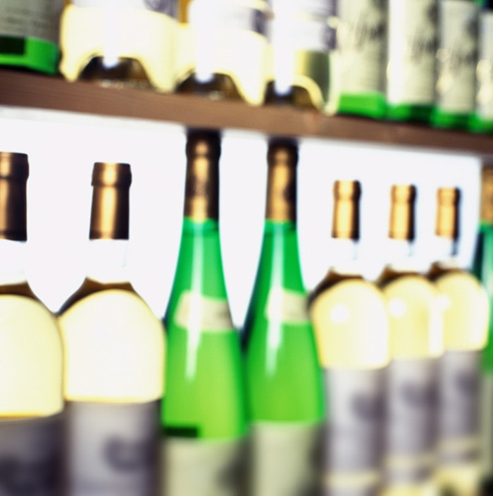 close-up of wine bottles in a wine cellar