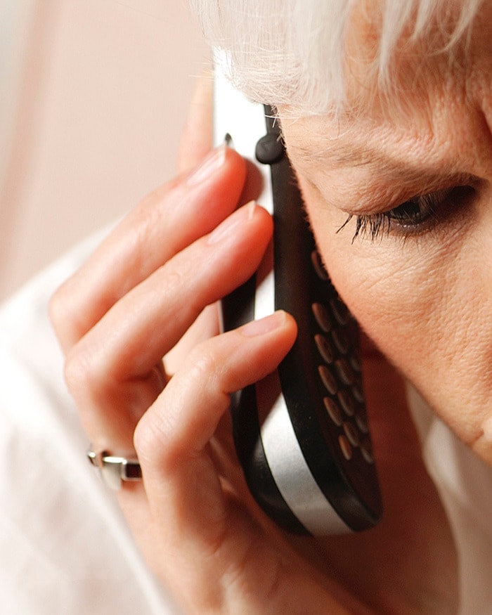 Distraught woman on cell phone