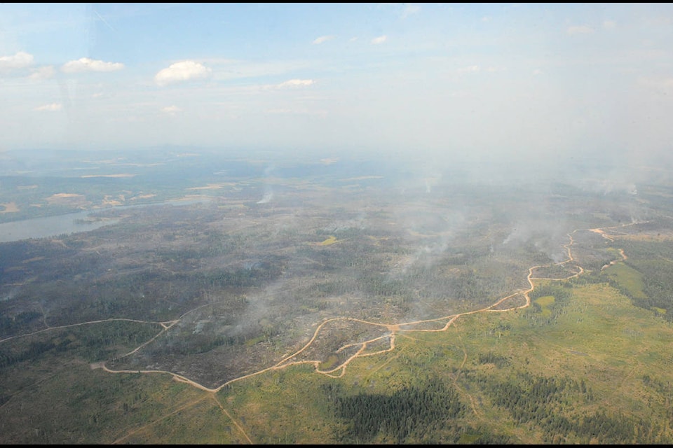 A fire guard flanks the Spokin Lake fire, seen here looking east.