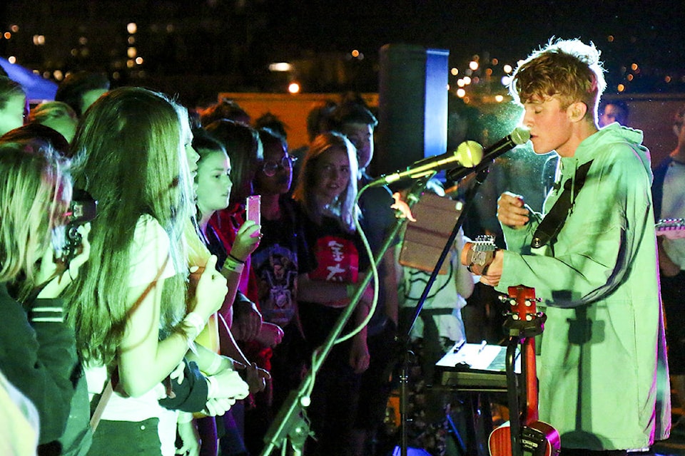 Aidan Andrews of //AMISTAD// ignites the stage during the Vernon Public Art Gallery’s ninth annual Riot on the Roof Saturday. (Parker Crook/Morning Star)