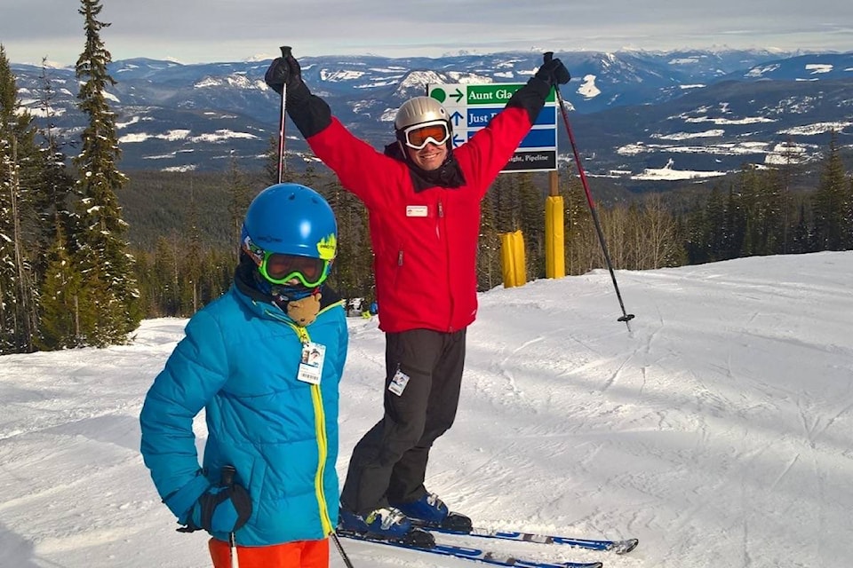 9528862_web1_171124-VMS-M-SSASS-student-Alex-Hiemstra-and-instructor-Blair-Crosby-celebrating-adventure-of-skiing-the-back-side-of-Silver-Star