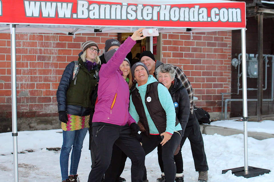 A team and family and friends who referred to themselves as ‘The Frosted Flakes’ stop to pose for a quick group selfie before heading out on the Coldest Night of the Year walk in Vernon Saturday night. The annual event is organized by the Upper Room Mission and sponsored by Bannister Honda. The walk raises funds that support the mission’s food security program. (Erin Christie/Morning Star)