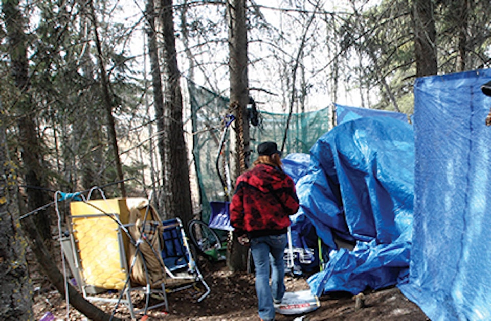 13675244_web1_homeless-camp-cropped