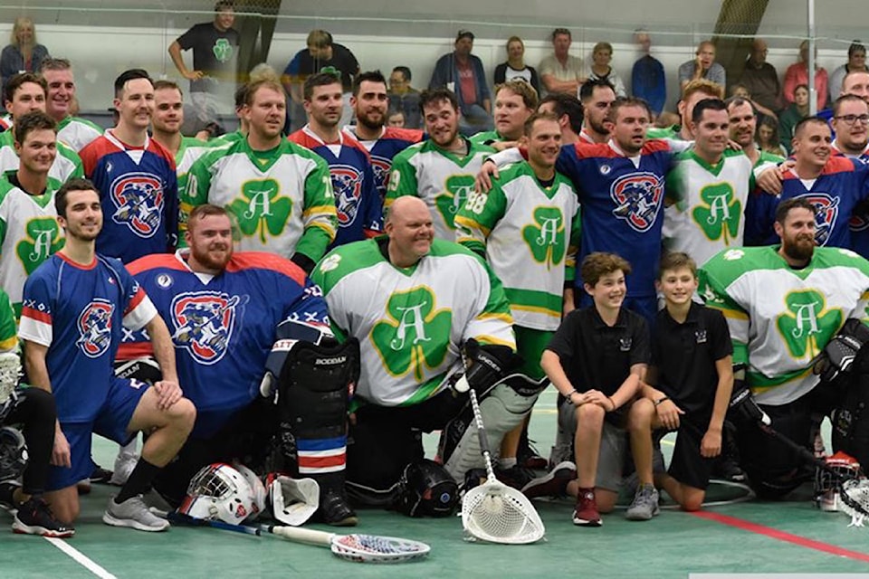 Members of the Armstrong Shamrocks and Team Slovakia gather for a group photo after an international friendly match between the two sides at the Hassen Memorial Arena. (Photo courtesy of Ryan Nitchie)