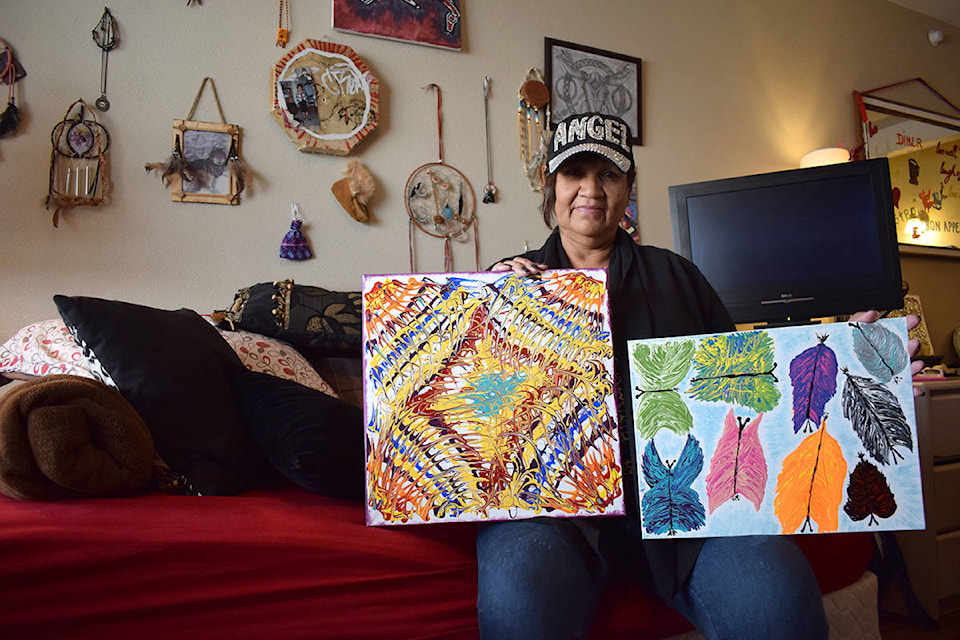 Vicki Durocher, 59, wants to sell her paintings to raise funds for a family displaced by a fire that destroyed their home on Thursday, Sept. 26, 2019. (Caitlin Clow - Vernon Morning Star)