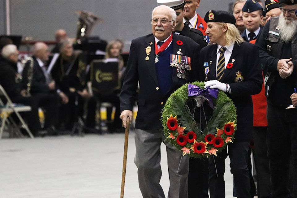 World War II veteran Nelson Whatmore places a wreath at the foot of the monument during Monday’s Remembrance Day Ceremony at Kal Tire Place in Vernon. (Brendan Shykora - Morning Star)