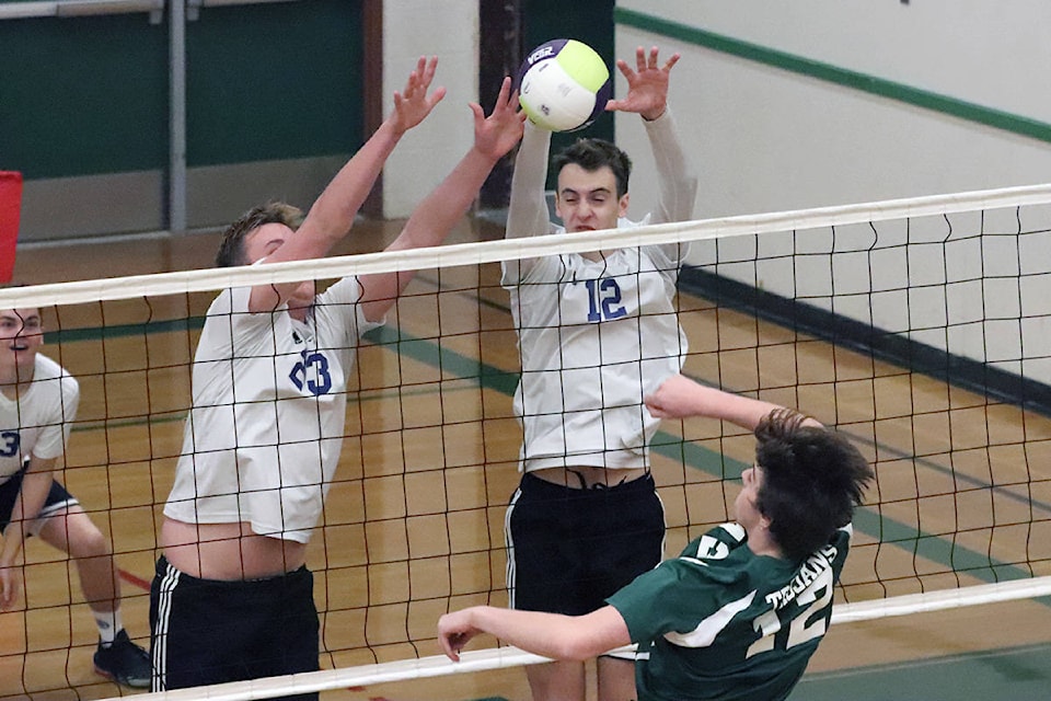 Vernon Christian School Royals blockers Josh Hall (23) and Liam Remple double team Chase Trojans’ hitter Jordan Fletcher during the Okanagan Valley High School Senior Boys A Volleyball Championships Friday, Nov. 8, at Charles Bloom Secondary in Lumby. (Roger Knox - Black Press)