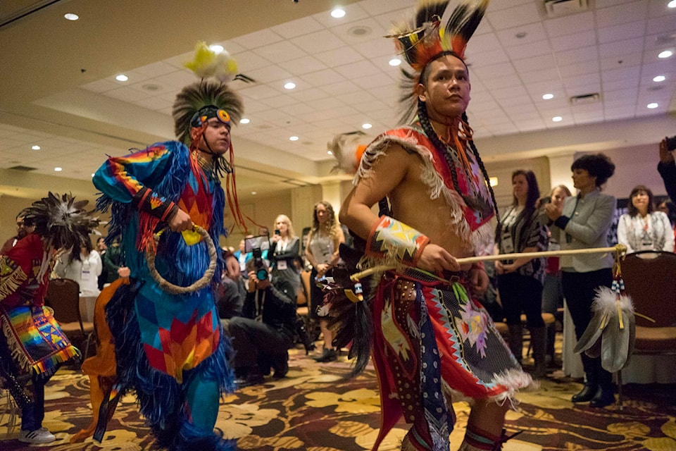 Dancers entering the hall at the Delta Grand Hotel during the grand entry procession of the International Indigenous Tourism Conference on Nov. 13. (Michael Rodriguez - Kelowna Capital News)