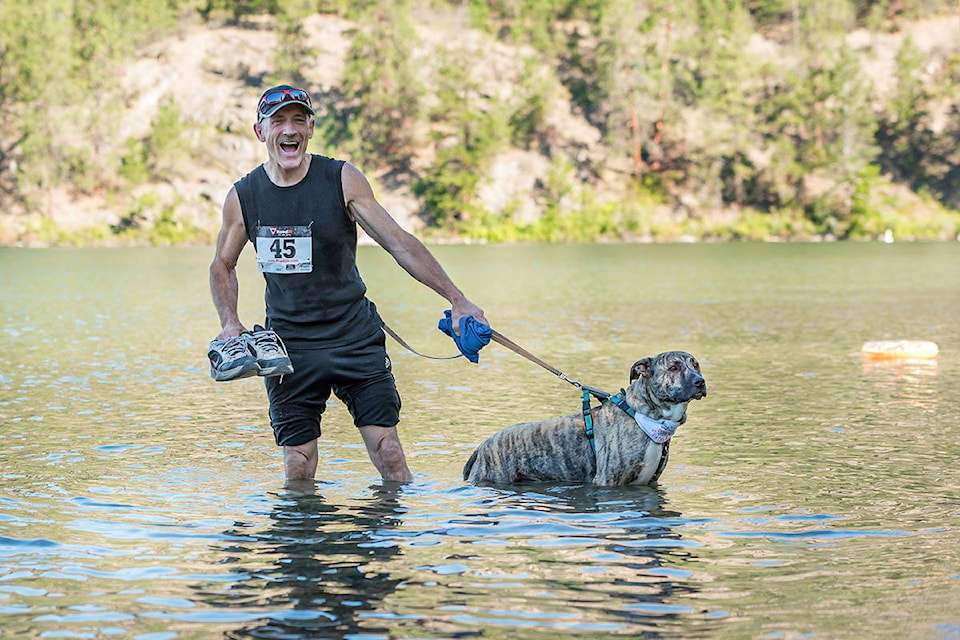 Brian Jones and his dog Kalvin are all smiles (well, Brian is smiling, not sure about Kalvin) as they take part in the ninth annual Doggie Duathlon Sunday, Aug. 9, at Kalamalka Lake Provincial Park in Coldstream. (Kiss The Monkey Photography)