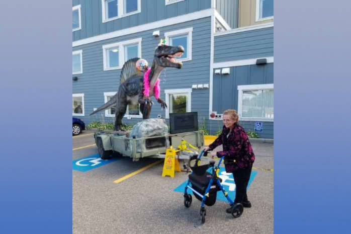 A 21-foot dinosaur made a special appearance at 91-year-old Marie Schnare’s birthday party Tuesday, Sept. 8, 2020. (Graham Schnare - Contributed)