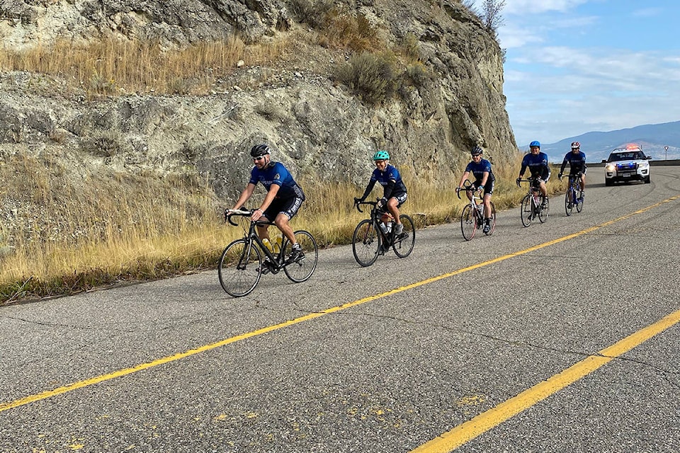 Vernon-North Okanagan RCMP Const. Nick Reimann leads a small group of riders between Vernon and Lake Country during the homecoming stretch of the 20th annual Cops For Kids cycling fundraiser. (Cops For Kids photo)