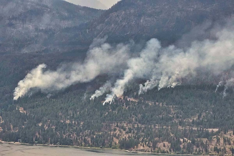 A photo of the White Rock Lake fire at Westside Road. (Darren Wolf/Facebook)