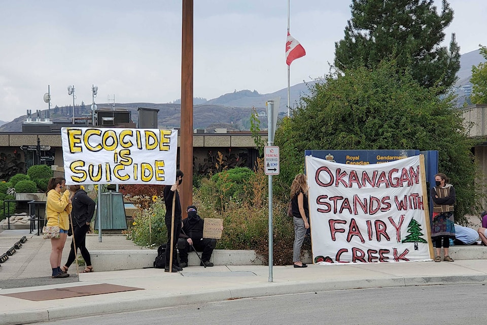 A crowd of approximately 30 protesters took part in the provincewide solidarity action: RCMP Stand Down on Monday, Aug. 23, out front of the Vernon RCMP detachment. (Roger Knox - Vernon Morning Star)
