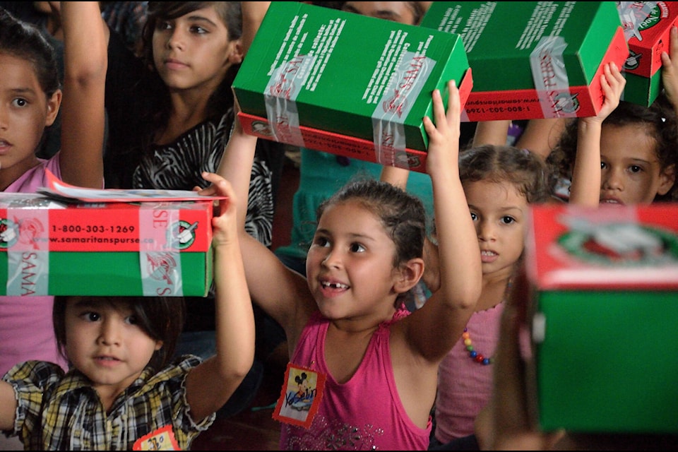 Children in Costa Rica show off their Operation Christmas Child shoebox before opening it. (Operation Christmas Child)