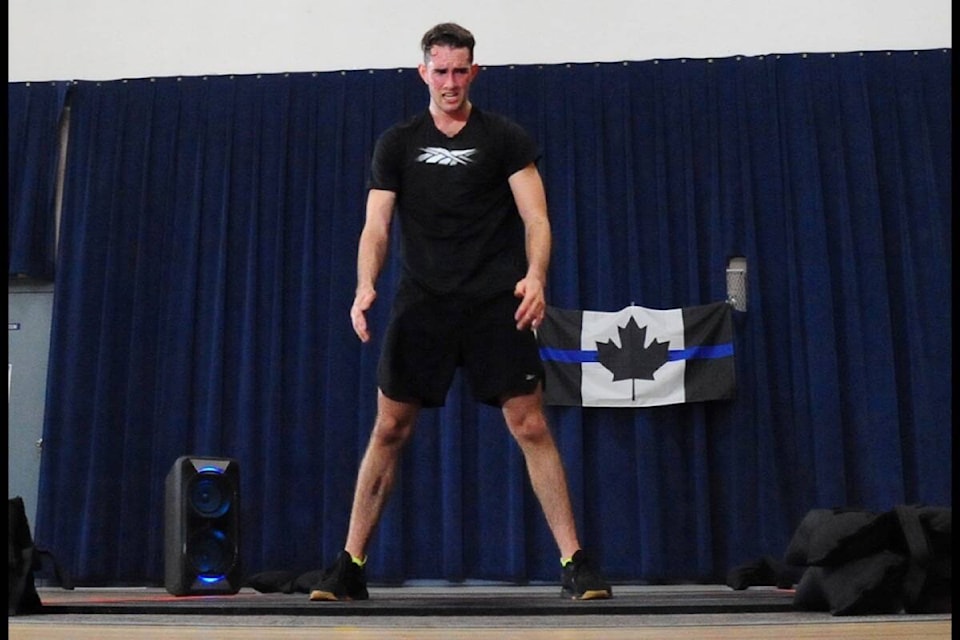 The strain begins to show on Mitchel Cook’s face as he attempts to set a new Guinness World Record for burpees. (Michael Briones photo)