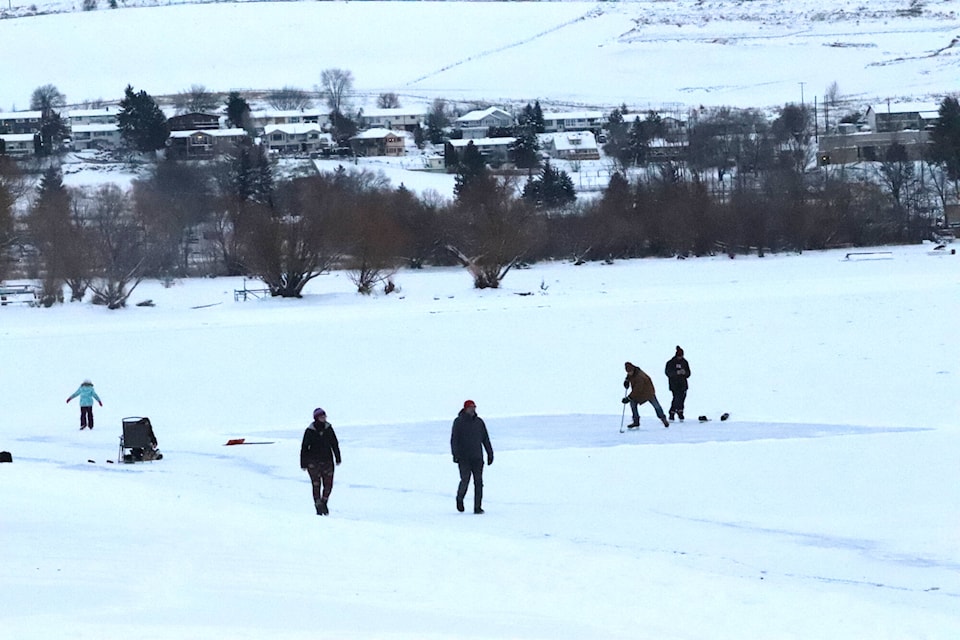 People were out braving the cold playing ice hockey and skating on frozen Okanagan Lake Wednesday, Dec. 29, 2021. (Brendan Shykora - Morning Star)