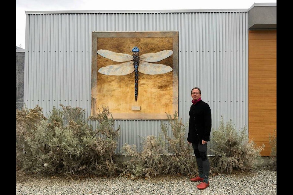Penticton artist Johann Wessels seen here with dragonfly mural at Liquidity Winery in OK Falls has been chosen to be part of the Penticton Square Mural Project. (Johann Wessels Facebook)